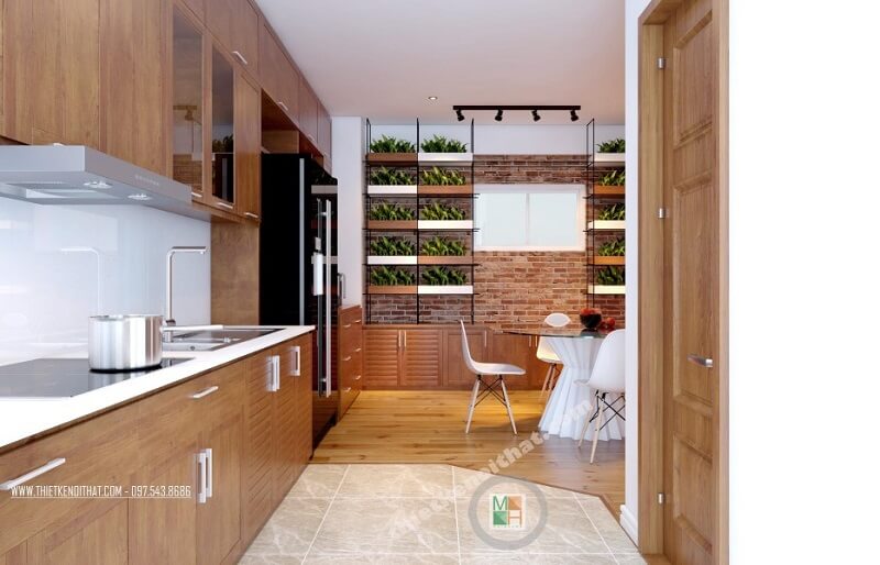 Hệ thống tủ bếp gỗ thiết kế đơn giản, hiện đại kéo dài tạo đô thoáng cho không gian mà vô cùng tiện dụng. Thiết kế tủ bếp chung cư